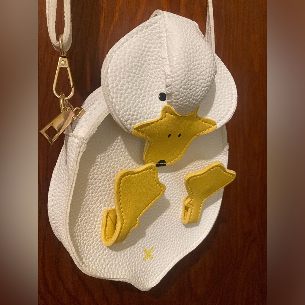 White and yellow faux leather duck purse.